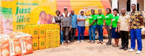 Ewuraba Adusei (6th from right), Marketing Manager of Wilmar Africa Ltd presenting the items to Miss Majorie Affenyi (4th from left), the Headmistress of the school